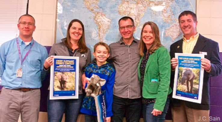 Ben Radke, center, is shown in this photo released by the National Wildlife Foundation.