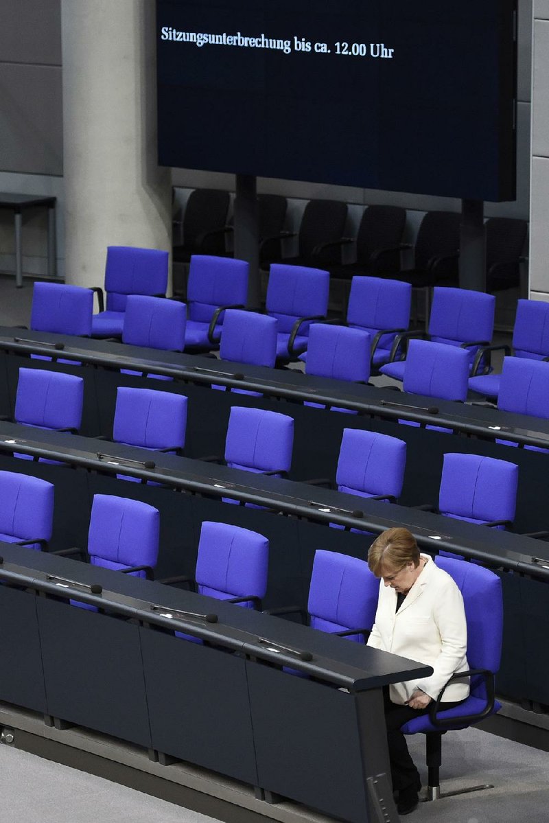 German Chancellor Angela Merkel sits in the German Bundestag on Wednesday after taking the oath in Berlin for her fourth term. 
