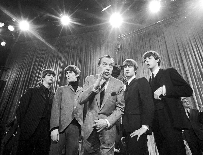 Ed Sullivan (center) stands with The Beatles during a Feb. 9, 1964, rehearsal for the British group’s first American appearance on his variety show. The Fab 4 are (from left) Ringo Starr, George Harrison, John Lennon and Paul McCartney.
