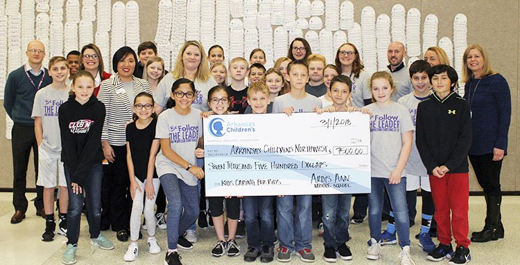 Courtesy photo The student council at Bentonville's Ardis Ann Middle School led a fundraiser for the Arkansas Children's Northwest hospital in Springdale. Students on March 1 presented a hospital representative a check for $7,500, far exceeding the council's original goal of $3,000, according to Marilyn Gilchrist, the school's principal.