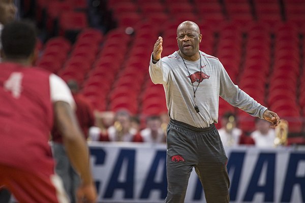 Arkansas coach Mike Anderson instructs players during practice Thursday, March 15, 2018, at Little Caesars Arena in Detroit. 