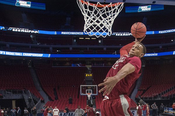 Arkansas center Daniel Gafford goes up for a dunk during practice Thursday, March 15, 2018, at Little Caesars Arena in Detroit. 