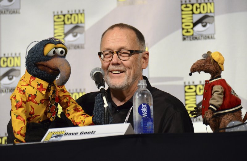  In this July 11, 2015 file photo, puppeteer Dave Goelz, center, appears with Muppet characters Gonzo, left, and Rizzo the Rat attend "The Muppets" panel at Comic-Con International in San Diego. Goelz is one of many Muppet artists shedding light on their creative processes and their characters’ secret backstories in a new documentary, “Muppet Guys Talking,” available online Friday. 

