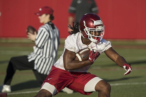 Arkansas running back Maleek Williams goes through drills Thursday, March 1, 2018, during practice in Fayetteville.