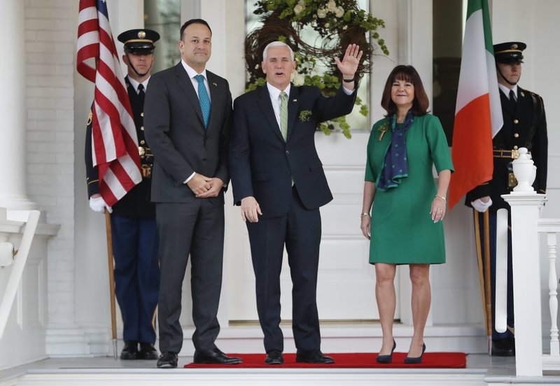 Vice President Mike Pence, center, and his wife wife Karen Pence, right, welcome Prime Minister Leo Varadkar of Ireland, left, to the U.S. Naval Observatory in Washington, Friday, March 16, 2018. 