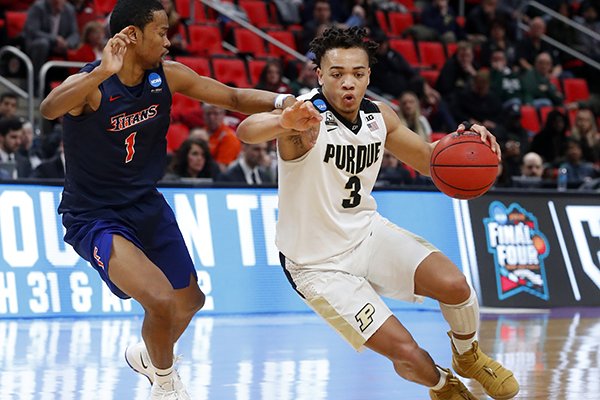 Purdue guard Carsen Edwards (3) drives on Cal State Fullerton guard Jamal Smith (1) during the second half of an NCAA men's college basketball tournament first-round game in Detroit, Friday, March 16, 2018.