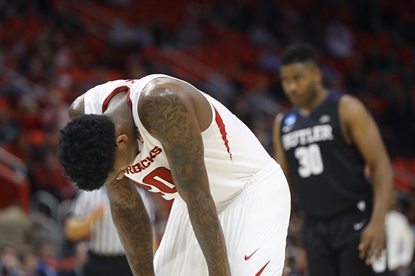 Arkansas forward Darious Hall (20) lowers his head in the closing moments against the Butler during the second half of an NCAA men's college basketball tournament first-round game in Detroit, Friday, March 16, 2018. Butler won 79-62. (AP Photo/Paul Sancya)


