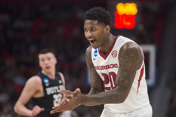 Arkansas forward Darious Hall claps after dunking the ball during an NCAA Tournament game against Butler on Friday, March 16, 2018, in Detroit. 