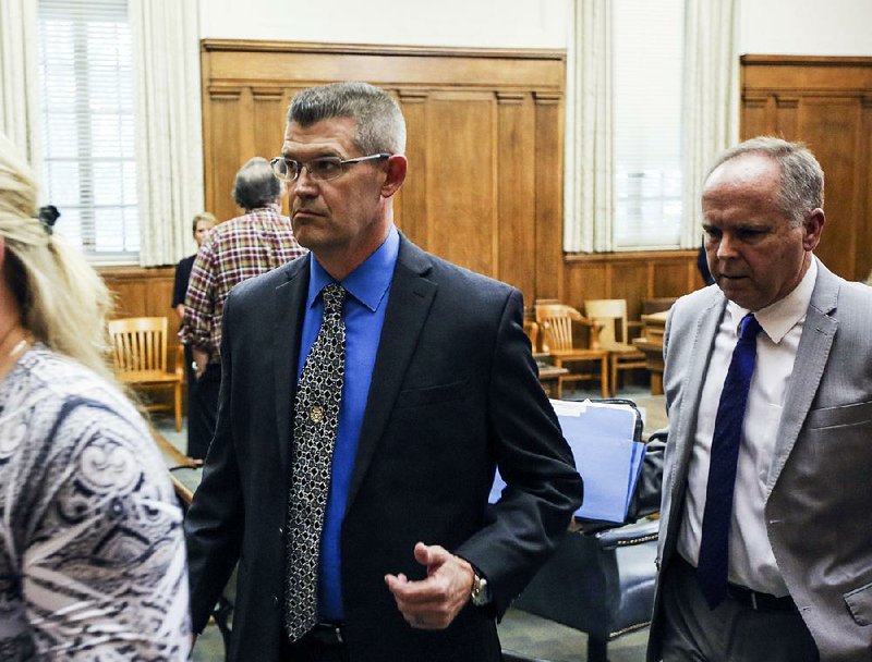 Jacksonville Police Chief Geoffrey Herweg, center, is shown in this 2017 file photo.