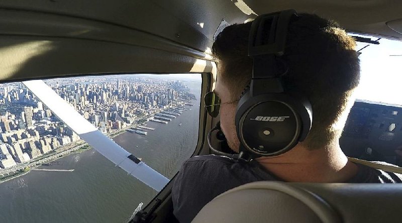 Aaron Ludomirski, an instructor for Infinity Flight Group, flies over the Hudson River in New York in 2017 as he worked to gain the required flying time to become an airline pilot. 