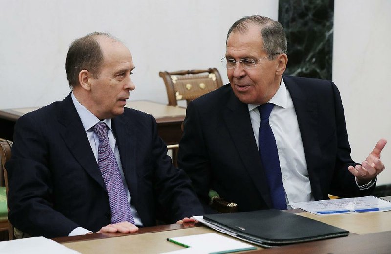 Russian Foreign Minister Sergey Lavrov (right) and Federal Security Service Director Alexander Bortnikov attend a meeting Thursday at the Kremlin. Lavrov called Britain’s accusations over the poisoning of a Russian ex-spy “boorish and unfounded.”
