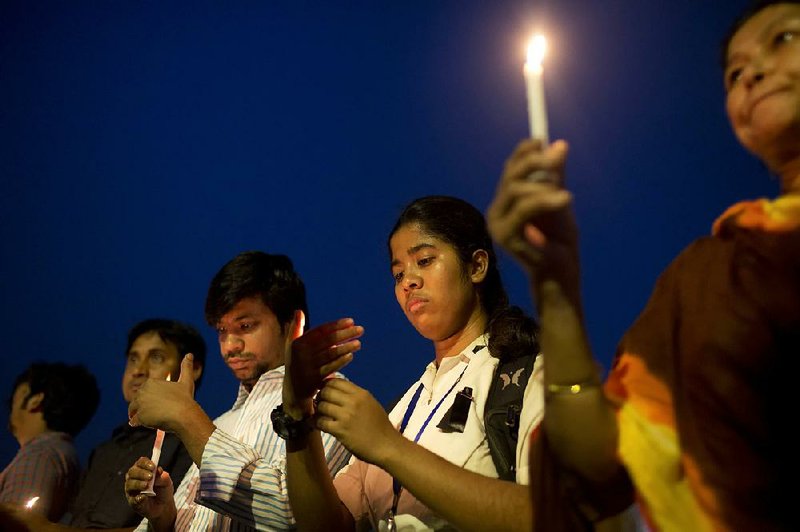 Bangladeshis gather Thursday at the parliament building in Dhaka to pay homage to the victims of Monday’s plane crash in Kathmandu, Nepal.
