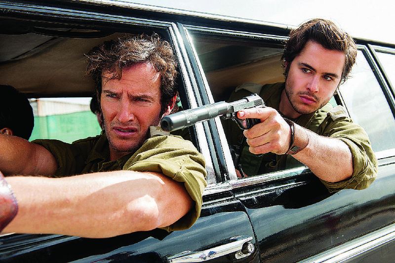 Yoni Netanyahu (Angel Bonanni) and Zeev Hirsch (Ben Schnetzer) are Israeli commandos called into action after a plane is hijacked in Jose Padilha’s 7 Days in Entebbe. 
