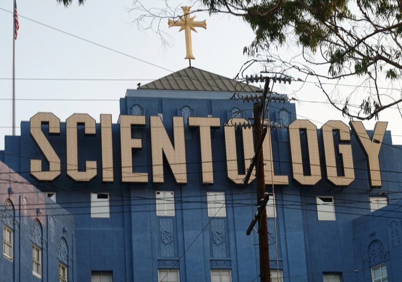 This Aug. 25, 2016, photo shows the Scientology Cross perched atop the Church of Scientology in Los Angeles. Scientology is about to get its own television channel starting Monday, March 11, 2018. A Twitter handle, website and app for Scientology TV appeared Sunday posting updates to hype the network's availability on DIRECTV, AppleTV, Roku, fireTV, Chromecast, iTunes and Google Play. (AP Photo/Richard Vogel)