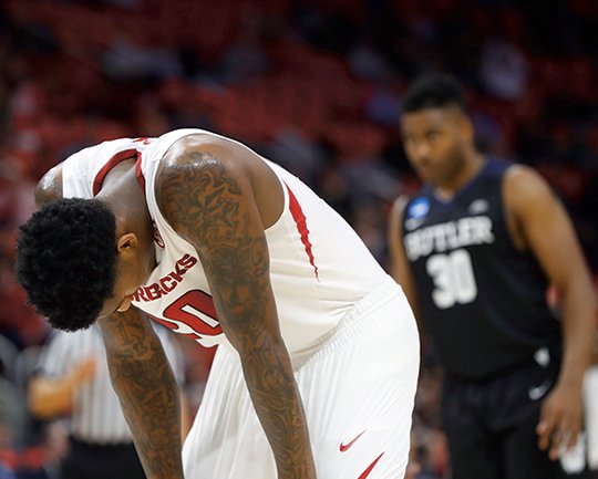 The Associated Press FIRST ROUND EXIT: Arkansas forward Darious Hall (20) lowers his head in the closing moments against Butler Friday as the Bulldogs ousted the Razorbacks, 79-62, in the first round of the NCAA Tournament in Detroit.