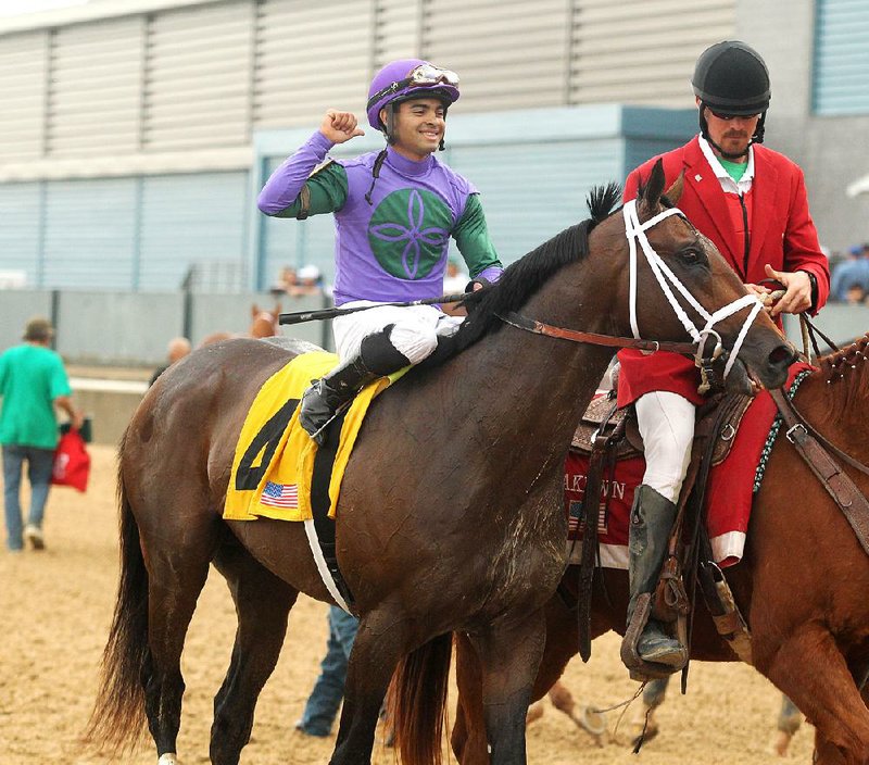 Magnum Moon and jockey Luis Saez won the $900,000 Grade II Rebel Stakes on Saturday at Oaklawn Park in Hot Springs.
