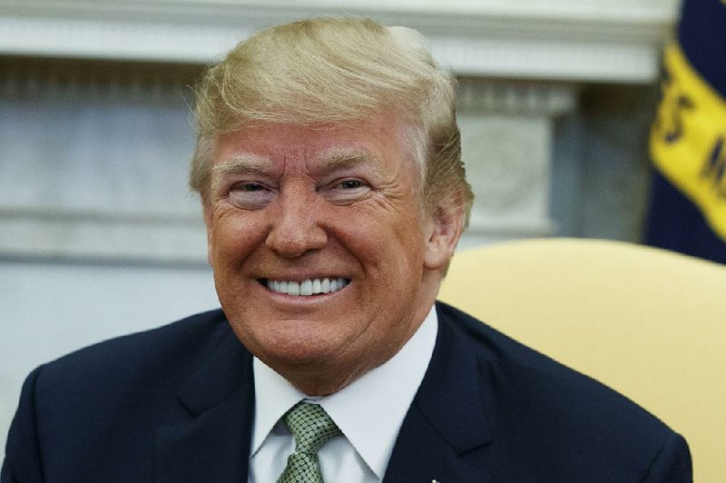 President Donald Trump smiles during a meeting with Irish Prime Minister Leo Varadkar in the Oval Office of the White House, Thursday, March 15, 2018, in Washington. (AP Photo/Evan Vucci)