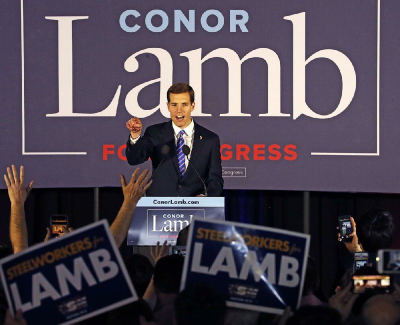 Conor Lamb, the Democratic candidate in last week’s special election for Pennsylvania’s 18th Congressional District, celebrates with supporters Wednesday in Canonsburg, Pa. Political analysts in Arkansas say Lamb’s apparent victory could be a good sign for Democrats nationally but that the state will likely remain a Republican stronghold.