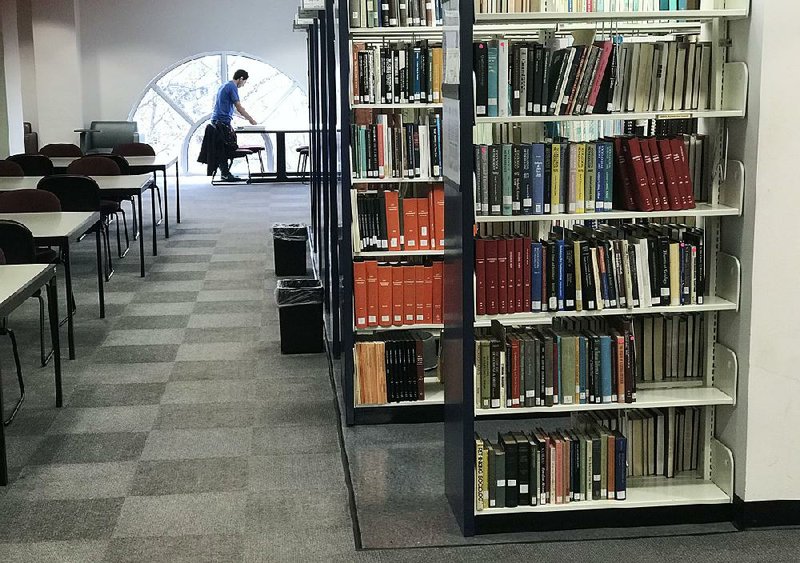 Books fill the shelves in the Mullins Library on the University of Arkansas, Fayetteville campus in this March 17, 2018 photo.