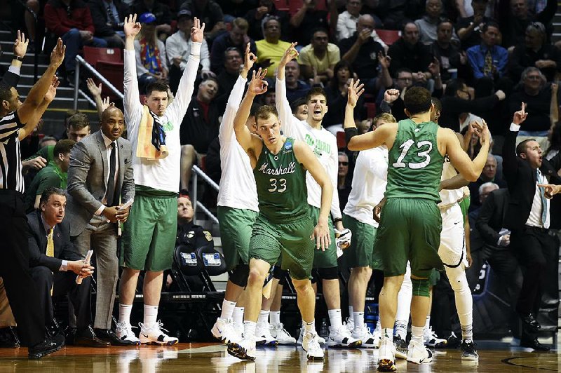 Marshall guard Jon Elmore (33) scored 27 points to lead the Thundering Herd to an 81-75 victory over Wichita State on Friday at the East Region of the NCAA Tournament in San Diego.
