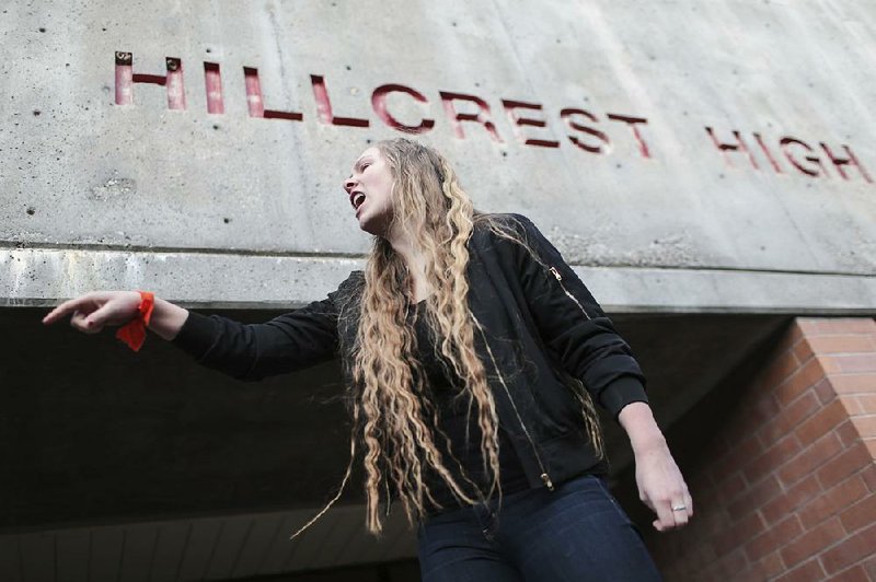 Hillcrest High School junior Kylee Denny addresses classmates Wednesday in Idaho Falls, Idaho, as they participate in a walkout to protest gun violence.