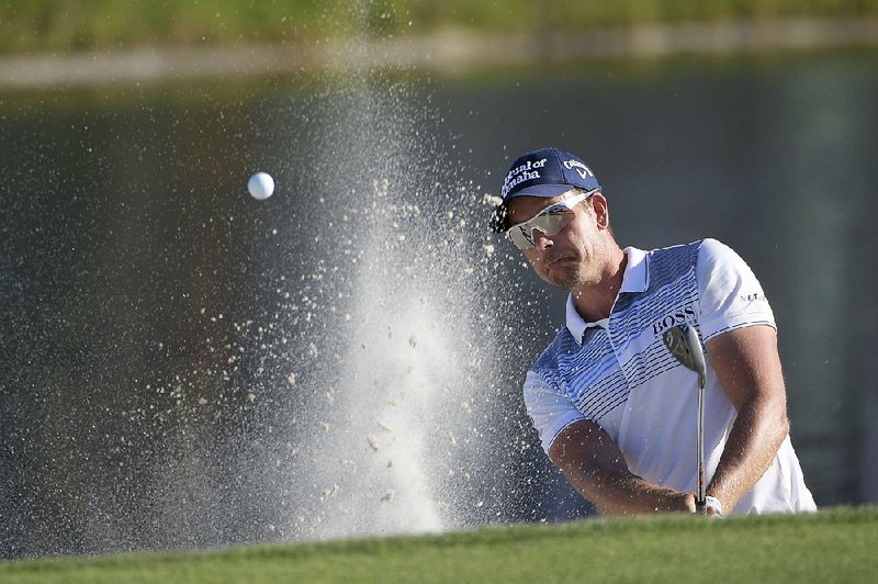 Henrik Stenson hits out of a bunker onto the 17th green during the third round of the PGA Arnold Palmer Invitational on Saturday.
