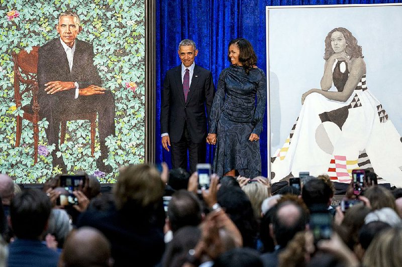 Michelle Obama arrives with former President Barack Obama for the unveiling of their portraits Feb. 12 at the Smithsonian National Portrait Gallery in Washington.