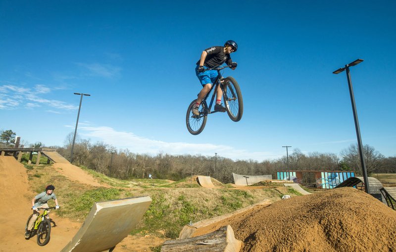 File Photo/NWA Democrat-Gazette/BEN GOFF  @NWABENGOFF Owen Polumbo (left) and Carson Brantley, both 13 and from Rogers, catch air on the expert line at The Railyard Bike Park in Rogers.