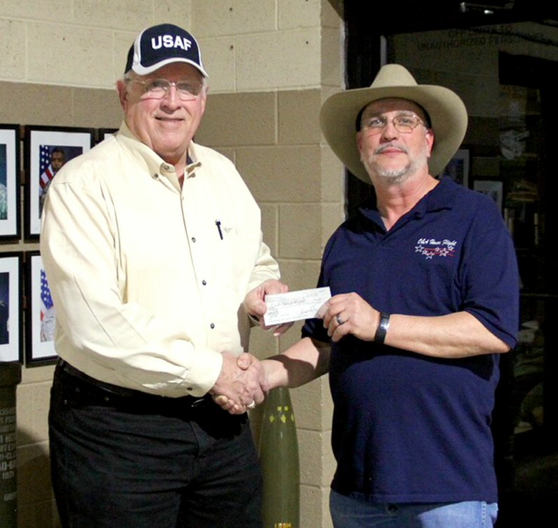Photo submitted J.W. Smith, of the Northwest Arkansas Veterans Coalition, presented Rob Hopkins, director of the O&amp;A Honor Flight, with a $500 donation during the O&amp;A Honor Flight banquet on March 10.