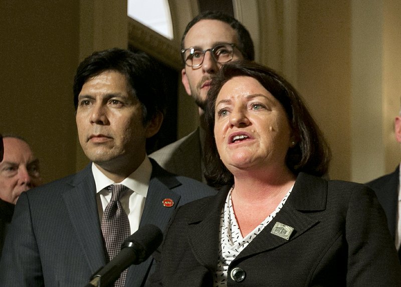 In this Sept. 15, 2017, file photo, state Sen. Toni Atkins, D-San Diego, right flanked by Senate President Pro Tem Kevin de Leon, D-Los Angeles, left, discusses a package of housing bills approved by the Legislature, during a news conference at the Capitol, in Sacramento, Calif. Atkins will make history Wednesday, March 21, 2018, when she becomes the first woman and first lesbian to hold the California Senate’s top job. (AP Photo/Rich Pedroncelli, File)