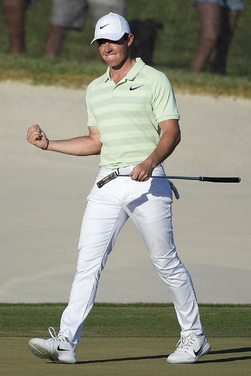 Rory McIlroy, of Northern Ireland, celebrates after making a birdie on the 18th green during the final round of the Arnold Palmer Invitational golf tournament Sunday, March 18, 2018, in Orlando, Fla. McIlroy won the tournament at 18-under-par. 