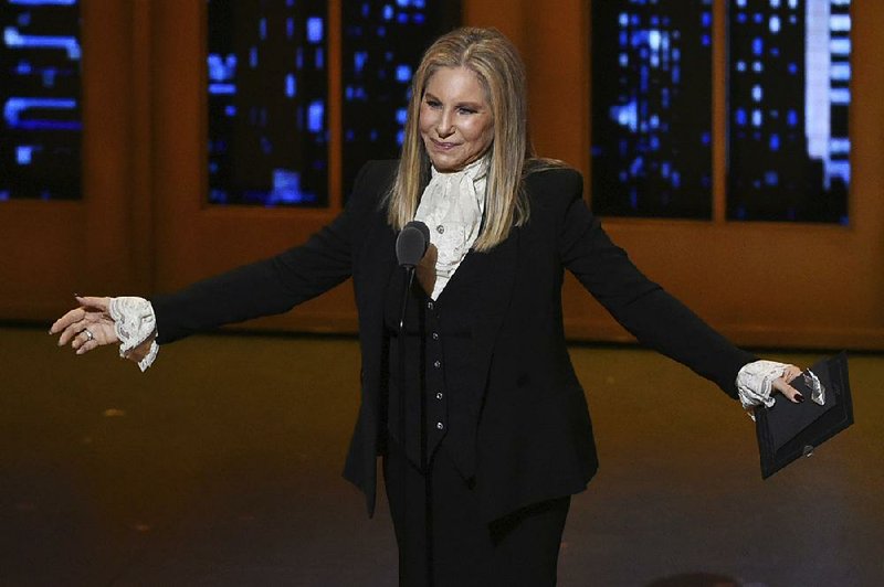 In this June 12, 2016, file photo, Barbra Streisand presents the award for best musical at the Tony Awards at the Beacon Theatre in New York. During a Friday, March 16, 2018 tribute to her decades of TV music specials and other programs, Streisand said she's never suffered sexual harassment but has felt abused by the media. (Photo by Evan Agostini/Invision/AP, File)