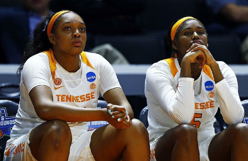 Tennessee center Kasiyahna Kushkituah (left) and center Kamera Harris watch during the second half of Sunday’s second-round game against Oregon State in the women’s NCAA Tournament in Knoxville, Tenn. The Beavers shocked the Lady Volunteers 66-59 as Tennessee lost for the first time at home in women’s NCAA Tournament history.