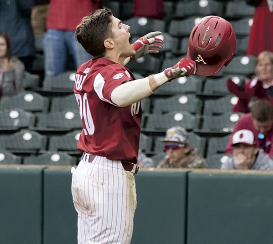 Special to The Sentinel-Record/Crant Osborne HOG WILD: Senior infielder Carson Shaddy, of Fayetteville, celebrates a three-run home run in the bottom of the first inning of Arkansas' 16-9 victory over No. 4 Kentucky in the third game of the weekend series and second game of a Saturday doubleheader at Baum Stadium.