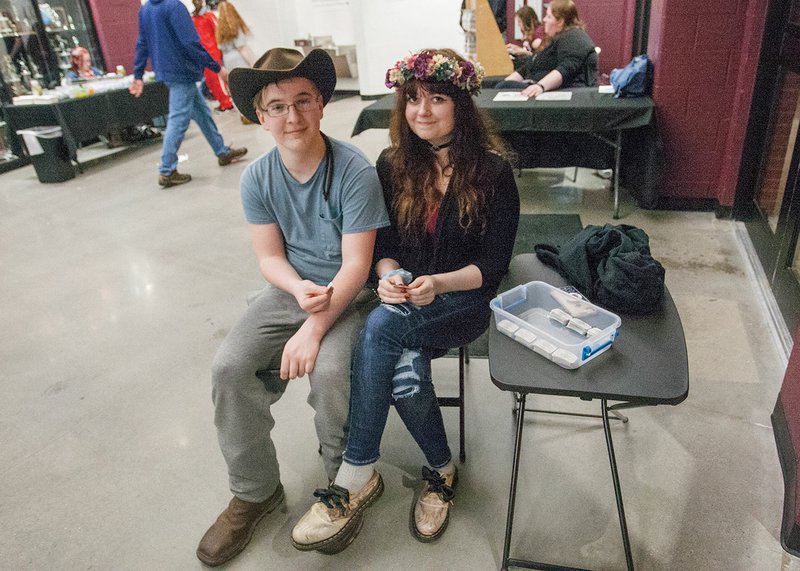 White County Central High School students Seth Brown, left, and Jessica Jones take up tickets at the front door of the gymnasium during the Class 2A State Basketball Tournament on Feb. 28. Brown is a sophomore, and Jones is a junior.