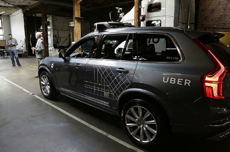 One of Uber’s autonomous vehicles is displayed in a San Francisco garage in this file photo.