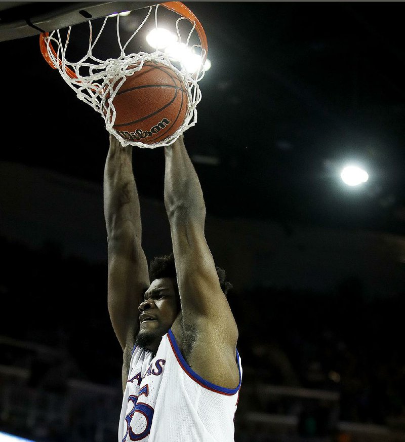 Kansas center Udoka Azubuike dunks during the second half of Saturday’s men’s NCAA Tournament second-round game against Seton Hall in Wichita, Kan. Kansas won 83-79. Coming back after missing most of  two weeks with an  injury, Azubuike played 22 minutes and scored 10 points.