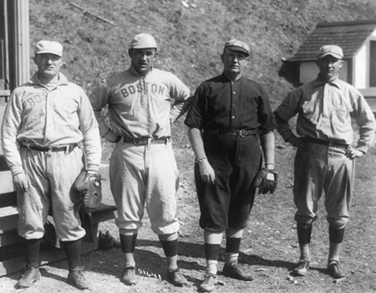 Submitted photo TEAMMATES: From left are Red Sox teammates Bill Carrigan, Jake Stahl, Hall-of-Famer Cy Young (dark uniform) and Fred Anderson at Whittington Park in Hot Springs, circa 1909. The image is from the George Grantham Bain Collection, Library of Congress Prints and Photographs Division.