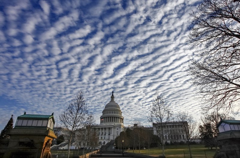 FILE - In this Dec. 22, 2017, file photo, the U.S. Capitol in the early morning in Washington. Top-level Capitol Hill talks on a massive $1.3 trillion catchall spending bill are reaching a critical stage as negotiators confront immigration issues, abortion-related controversies, and a battle over a massive rail project that pits President Donald Trump against his most powerful Democratic adversary. (AP Photo/J. Scott Applewhite, File)