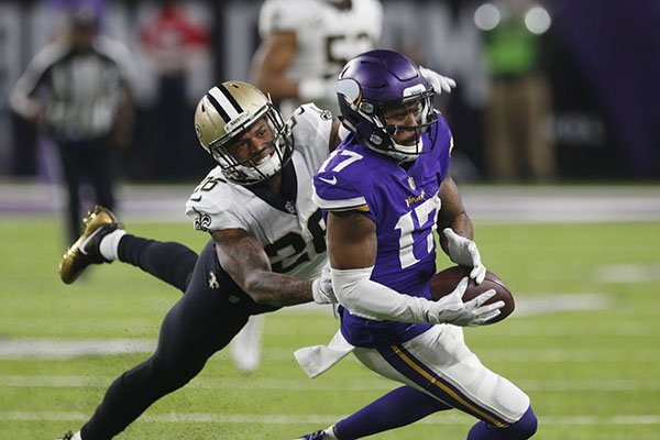 Minnesota Vikings wide receiver Jarius Wright (17) makes a catch in front of New Orleans Saints cornerback P.J. Williams (26) during the second half of an NFL divisional football playoff game in Minneapolis, Sunday, Jan. 14, 2018. (AP Photo/Jim Mone)

