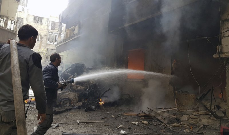 This photo released by the Syrian Civil Defense White Helmets, which has been authenticated based on its contents and other AP reporting, Civil Defense workers putting out a fire following airstrikes and shelling in Douma, in the eastern Ghouta region near Damascus, Syria today. The U.N. refugee agency says 45,000 Syrians have left their homes in the besieged region of eastern Ghouta in recent days, amid a Syrian government-led offensive against the rebel-held area. 
