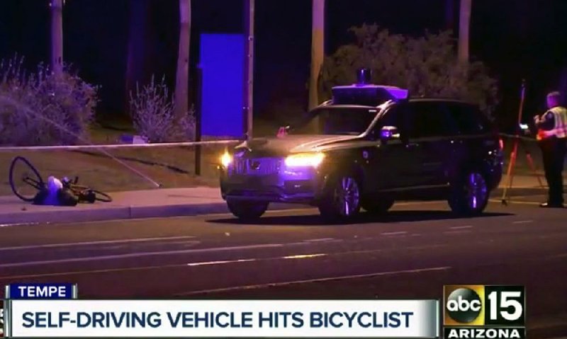 This image taken from video provided by a Tempe, Ariz., television station shows investigators at the scene of a fatal accident Sunday night involving a self-driving Uber car and a pedestrian. Police say video taken from the car just before the accident shows the victim move into the street in front of the car, which was in autonomous mode.  