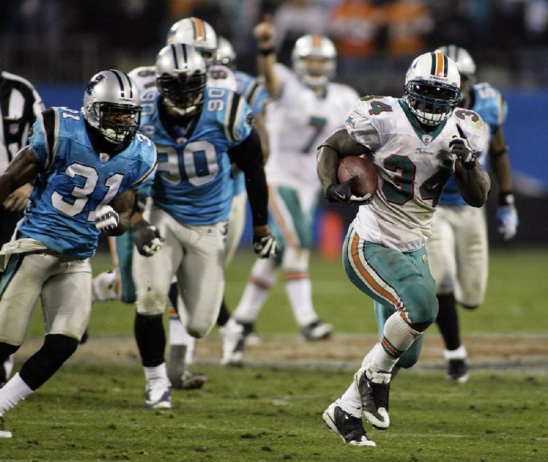 Former Miami Dolphins running back Ricky Williams (34) has launched his brand of medical marijuana products that will be sold in California dispensaries.  