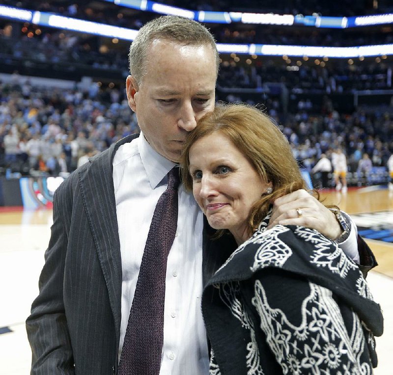 Texas A&M Coach Billy Kennedy hugs his wife, Mary, after the Aggies beat North Carolina on Sunday at the NCAA Tournament in Charlotte, N.C. Kennedy’s team has had its ups and downs this season, but has still managed to advance to the Sweet 16, where the Aggies will face Michigan on Thursday night in Los Angeles. “Trials can break you or make you, and I think it’s made this team closer and recognize that they need each other,” Kennedy said.  