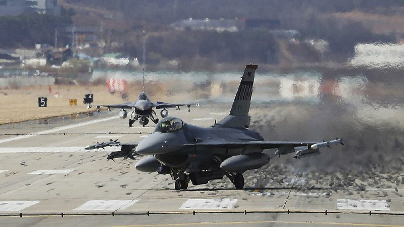 U.S. Air Force F-16 fighter jets land Tuesday at Osan Air Base in Pyeongtaek, South Korea.  