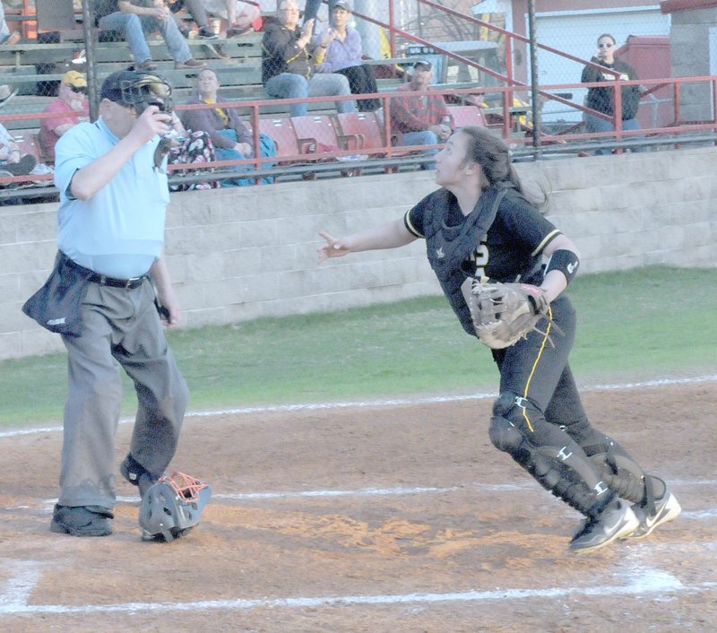 MARK HUMPHREY ENTERPRISE-LEADER Prairie Grove junior catcher Sara Benton has the mask off trying to catch a pop-up behind home plate during the Lady Tigers' 11-5 loss to Conway during the Farmington Invitational softball tournament Friday.