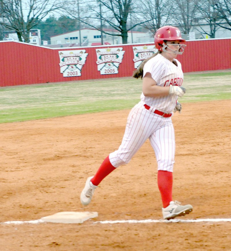 MARK HUMPHREY ENTERPRISE-LEADER Farmington senior Carley Antwine rounds third base after blasting a 2-run homer out of the ballpark during the Lady Cardinals' 16-2 loss to Bentonville West in the championship game of the Farmington Invitational Softball tournament Saturday.