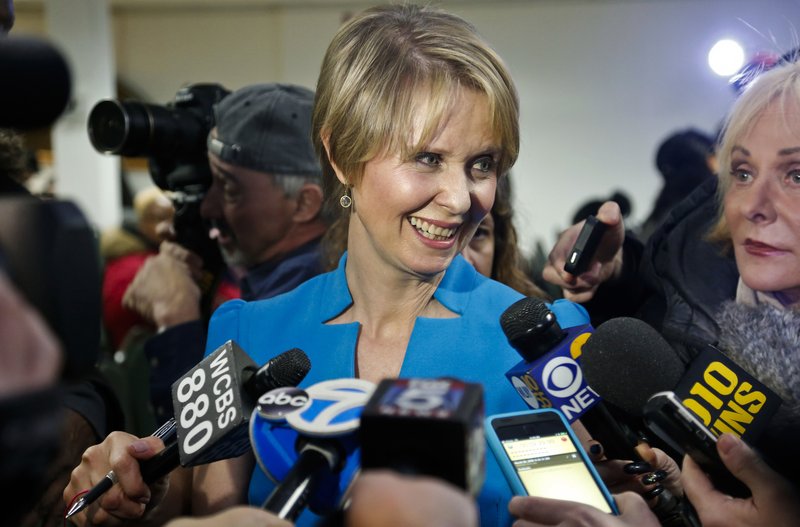 In this March 20, 2018 file photo, New York candidate for governor Cynthia Nixon speaks during her first campaign stop after announcing she would challenge New York Gov. Andrew Cuomo for the Democratic nomination, at a church in the Brooklyn borough of New York. The "Sex and the City" star is bidding to become the first openly gay person to hold the state's highest office while the two-term incumbent has enjoyed strong support from the gay community for being a driving force behind the 2011 legislation that allowed same-sex couples to wed. 