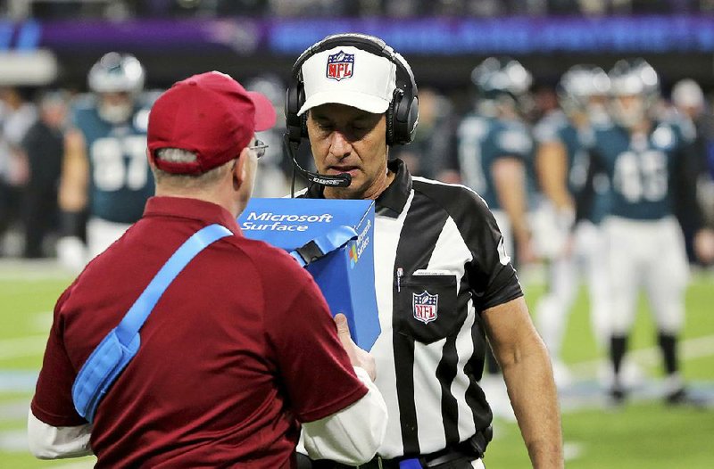 Referee Gene Steratore reviews a touchdown reception during Super Bowl 52 on Feb. 4 in Minneapolis. The NFL’s catch rule could get less complicated if team owners approve recommendations from the competition committee when the league’s annual meetings begin Monday in Orlando, Fla. 