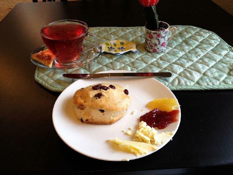 A cup of fruity Blueberry Lemongrass tea and a cranberry pecan scone with all the spreads is perfect for a rainy afternoon snack at Abbi’s Teas & Things.  